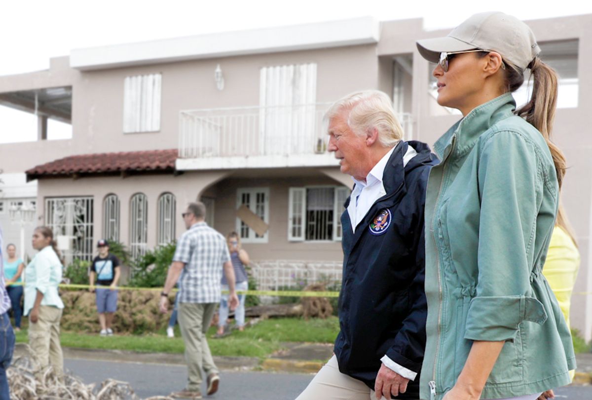 Donald and Melania Trump take a walking tour to survey hurricane damage and recovery efforts in Puerto Rico. (AP/Evan Vucci)