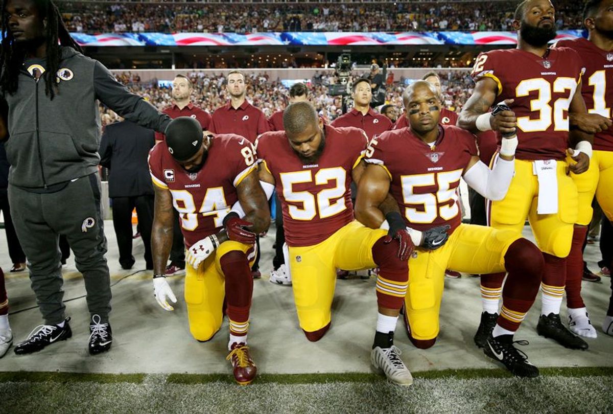 NFL players kneel during the the national anthem at FedExField on September 24, 2017. (Getty/Patrick Smith)
