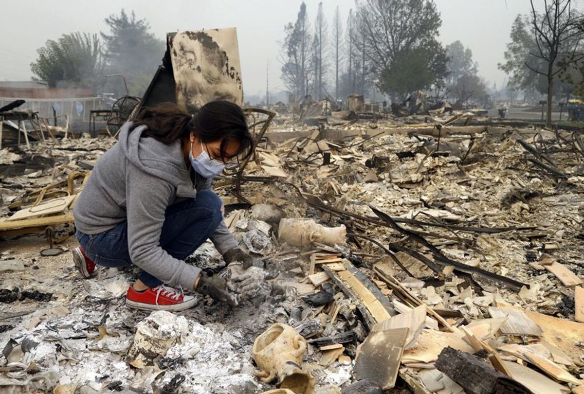 Leslie Garnica searches in the ashes of her home that was destroyed by fire in Santa Rosa, Calif., Oct. 10, 2017.
 (AP/Ben Margot)