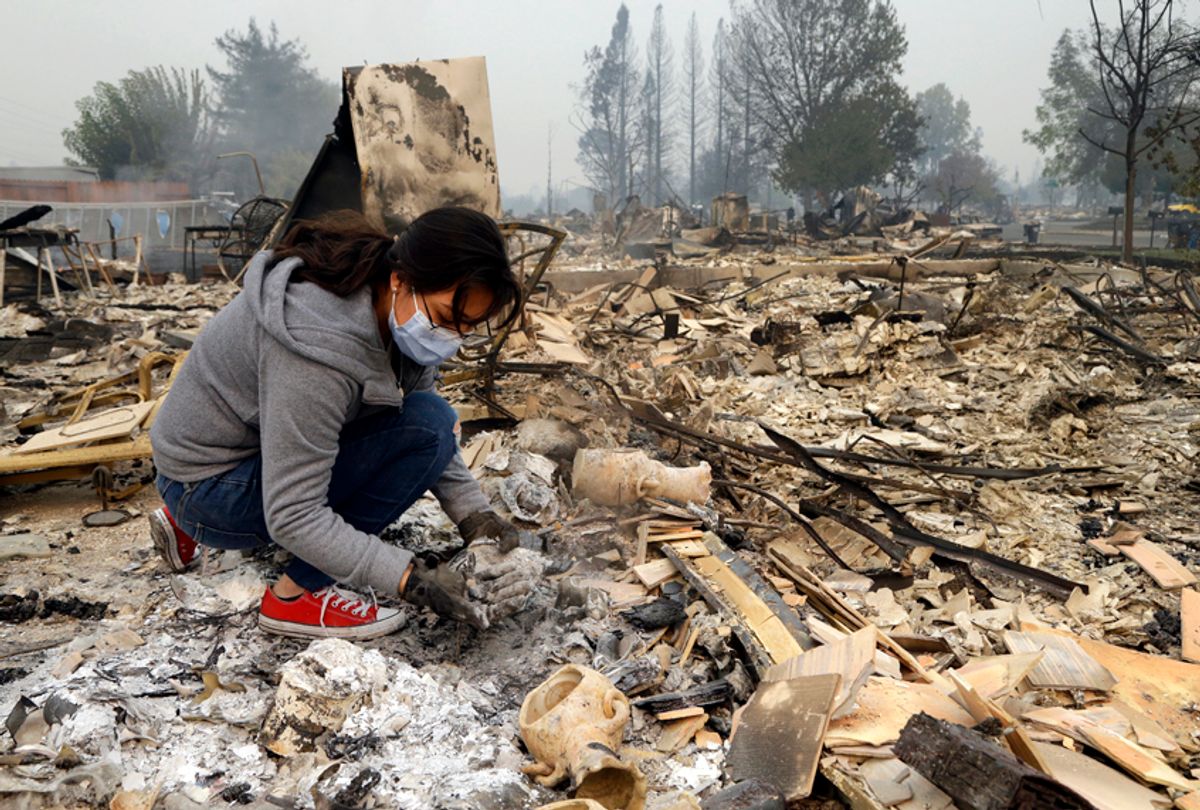 Leslie Garnica searches in the ashes of her home that was destroyed by fire in Santa Rosa, Calif., Oct. 10, 2017. (AP/Ben Margot)