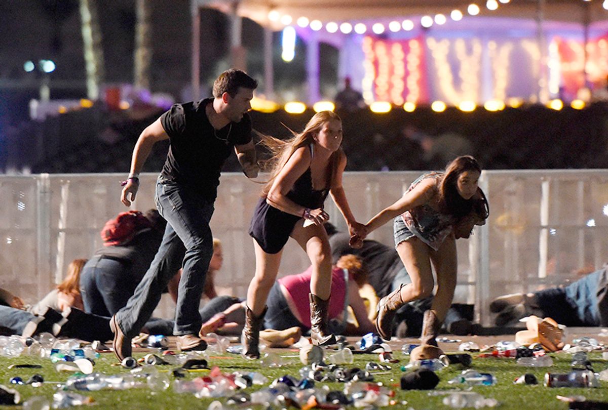 People run from gunfire at a country music festival on October 1, 2017 in Las Vegas, Nevada. (Getty/David Becker)