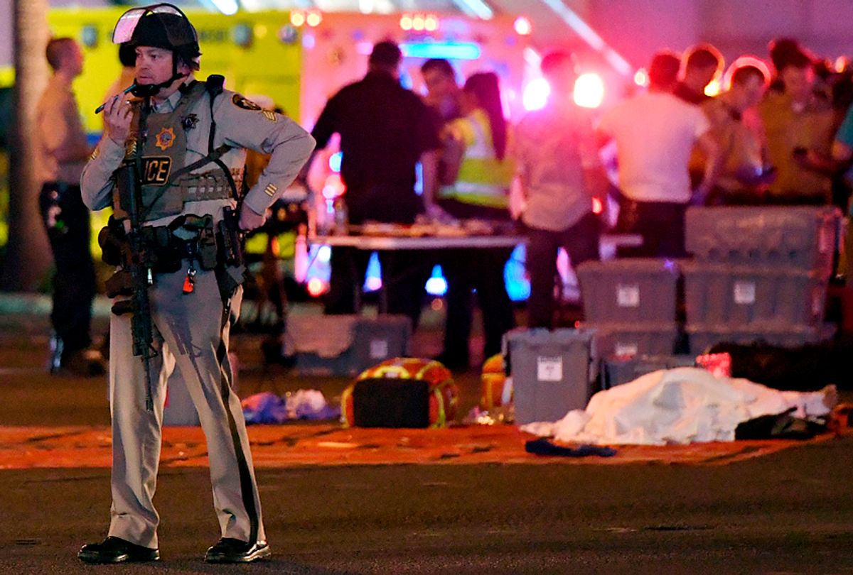 A Las Vegas Metropolitan Police officer stands after a mass shooting at a country music festival on October 2, 2017. (Getty/Ethan Miller)