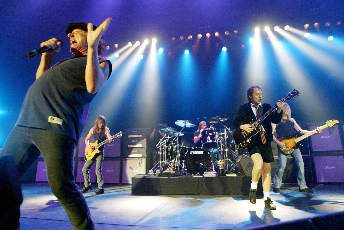 FILE - This June 17, 2003 file photo shows British rock band AC/DC, from left, Brian Johnson, Malcolm Young, Phil Rudd, Angus Young, and Cliff Williams performing on stage during a concert in Munich, southern Germany. The band says Young is not returning to the band after he announced he was taking a break from the group to focus on his health in April. A Wednesday statement from the bands label said: Unfortunately, due to the nature of Malcolm's condition, he will not be returning to the band. AC/DC will release the album Rock or Bust on Dec. 2. (AP Photo/Jan Pitman, File) (AP)