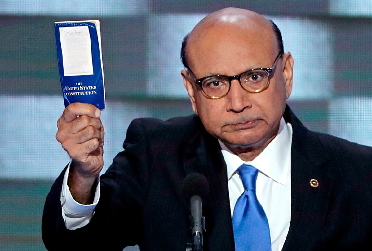 Khizr Khan, father of deceased Muslim U.S. Soldier, holds up a booklet of the US Constitution as he speaks at the Democratic National Convention. (Getty/Alex Wong)