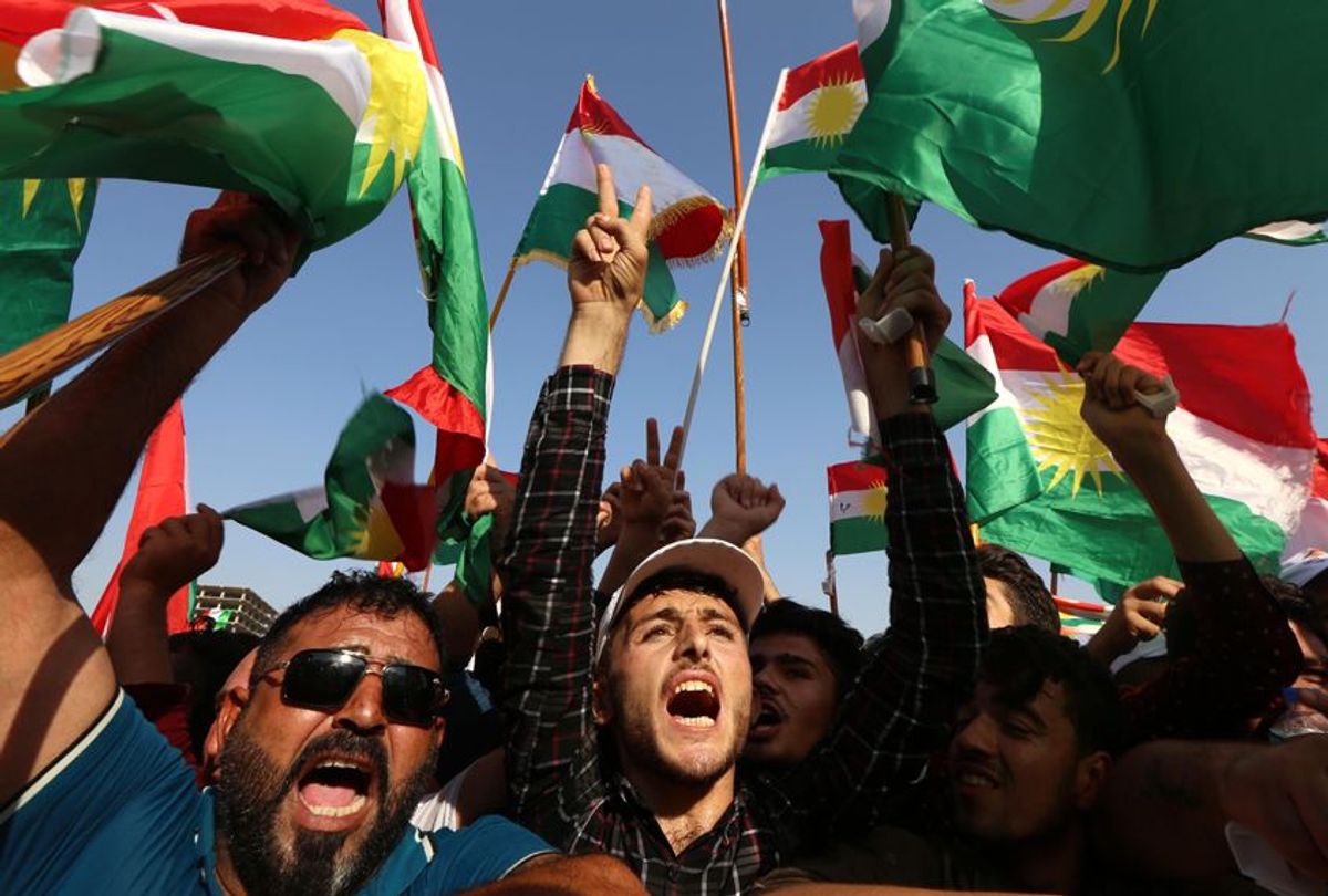 Iraqi Kurds fly Kurdish flags during an event to urge people to vote in the upcoming independence referendum in Arbil, Iraq, on September 22, 2017. (Getty/Safin Hamed)
