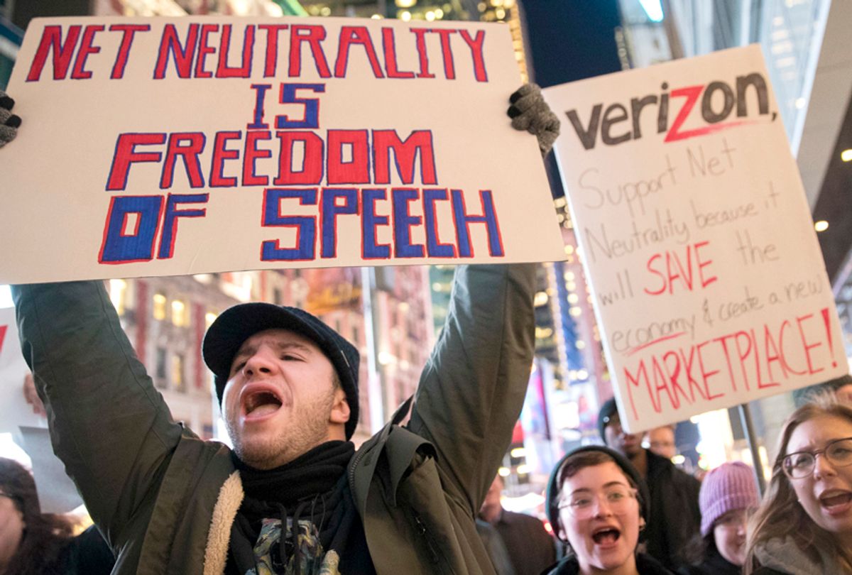 Demonstrators rally in support of net neutrality outside a Verizon store (AP/Mary Altaffer))