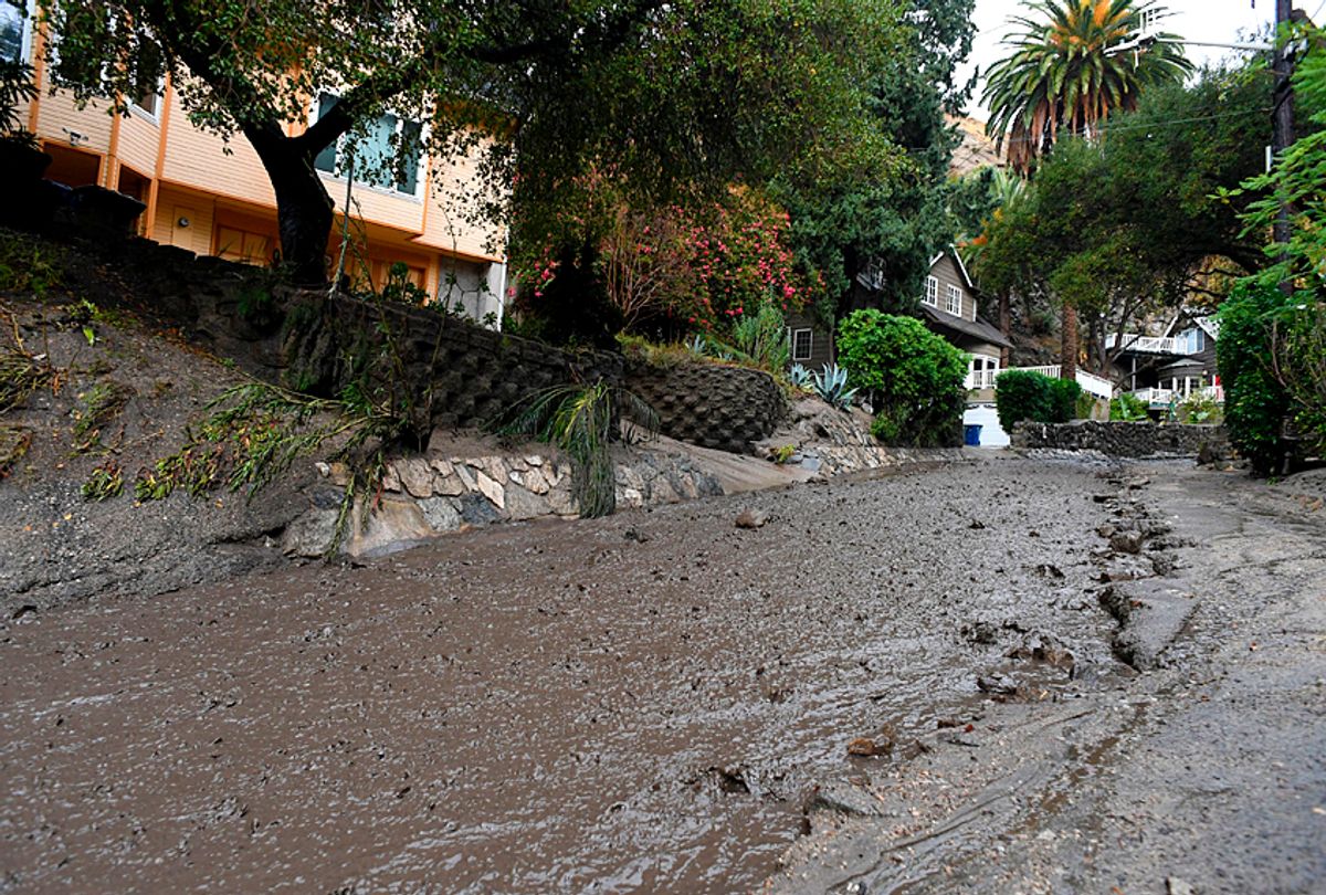 Rain and mud flow out of an neighborhood under mandatory evacuation in Burbank, California, January 9, 2018. (Getty/Robyn Beck)