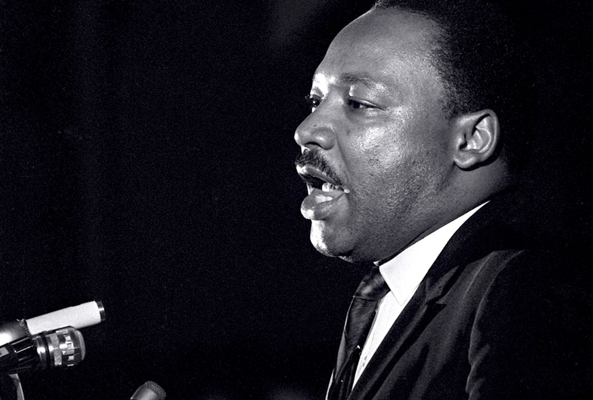 Dr. Martin Luther King Jr. makes his last public appearance at the Mason Temple in Memphis, Tenn., on April 3, 1968.  (AP/Charles Kelly)