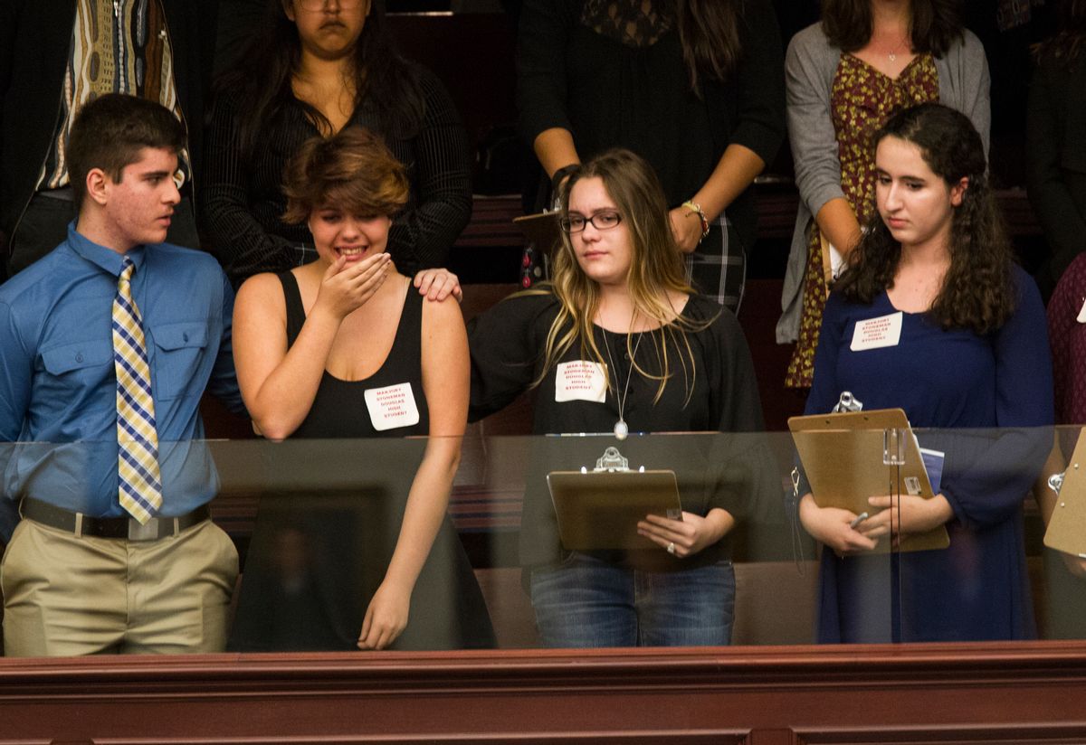 Sheryl Acquarola, a 16 year-old junior from Marjory Stoneman Douglas High School is overcome with emotion in the east gallery of the House of Representatives after the representatives voted not to hear the bill banning assault rifles and large capacity magazines at the Florida Capital in Tallahassee, Fla., Tuesday, Feb 20, 2018.  (AP Photo/Mark Wallheiser)