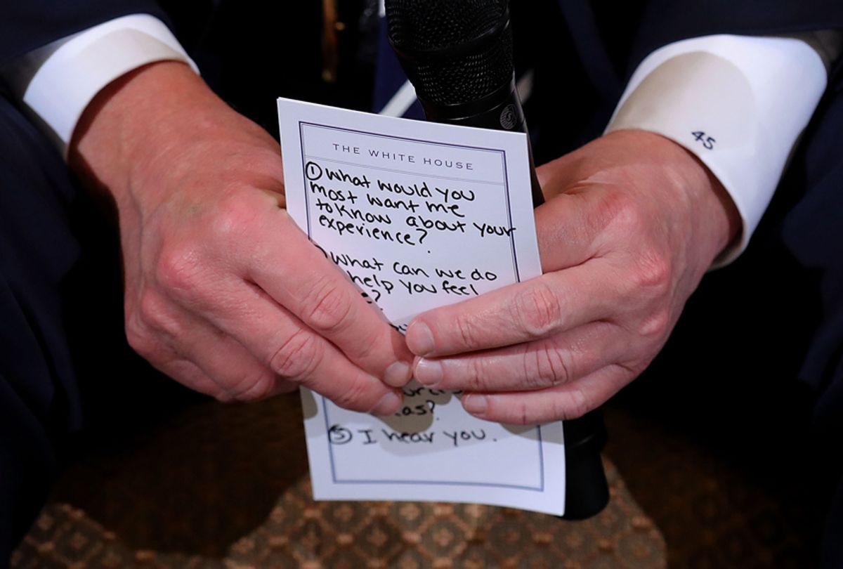 Donald Trump holds his notes while hosting a listening session with students survivors of mass shootings at the White House, February 21, 2018 in Washington, DC. (Getty/Chip Somodevilla)