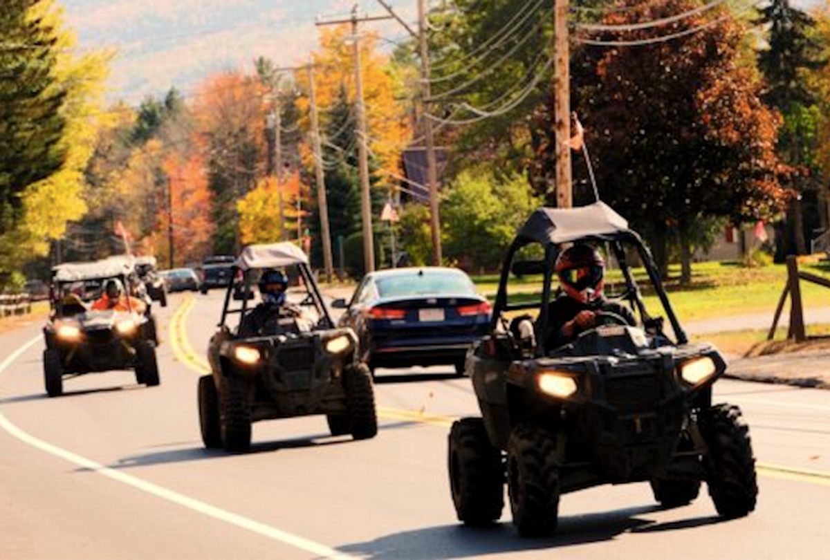 Polaris recreational off-highway vehicles riding on a highway in Gorham, N.H. (Christopher Jensen)