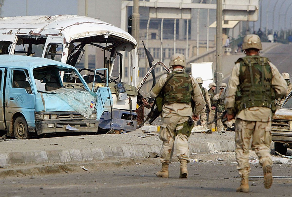  US Army soldiers investigate the site of an explosion, January 18, 2004 in Baghdad, Iraq (Getty/Mario Tama)