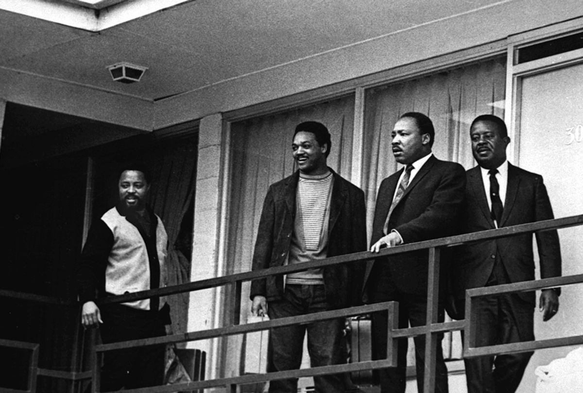 The Rev. Martin Luther King Jr. stands with other civil rights leaders on the balcony of the Lorraine Motel in Memphis, Tenn., on April 3, 1968, a day before he was assassinated.  (AP)