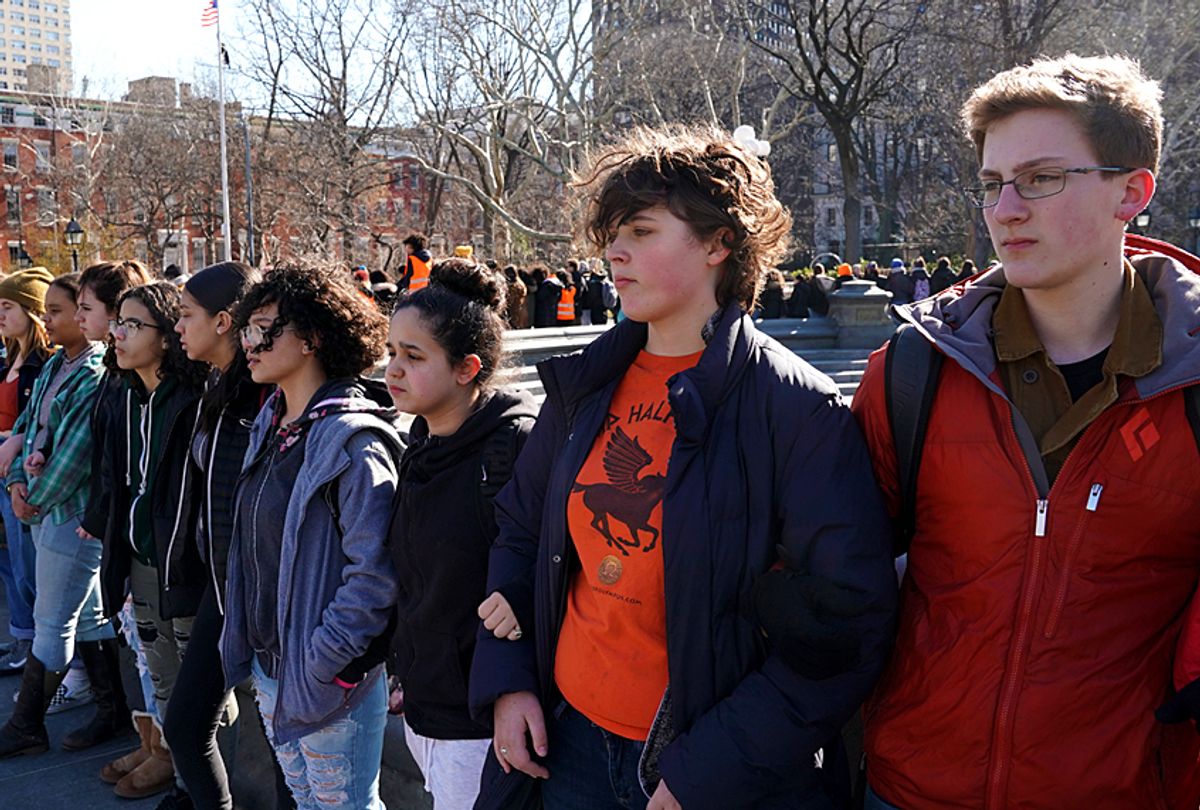 Students from Harvest Collegiate High School form a circle around the fountain in Washington Square Park on March 14, 2018 in New York to take part in a national walkout to protest gun violence.  (Getty/Timothy A. Clary)