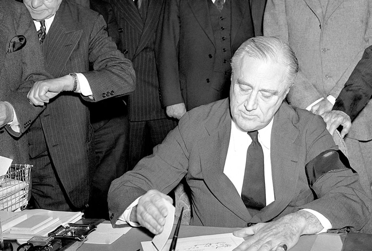 Fraklin Roosevelt signing the declaration of war on Dec. 8, 1941. (AP Photo)
