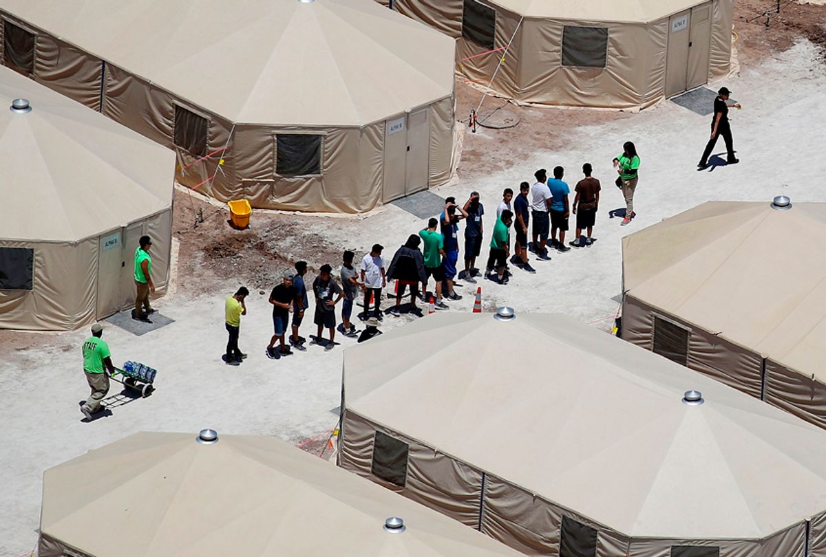 Children and workers are seen at the Tornillo tent camp which houses immigrant children separated from their parents after they were caught entering the U.S. under the administration's zero tolerance policy. (Getty/Joe Raedle)