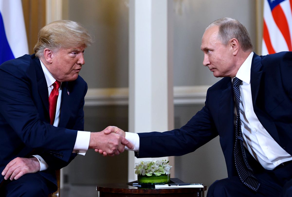 Donald Trump and Vladimir Putin  shake hands before a meeting in Helsinki, on July 16, 2018. (Getty/Brendan Smialowski)
