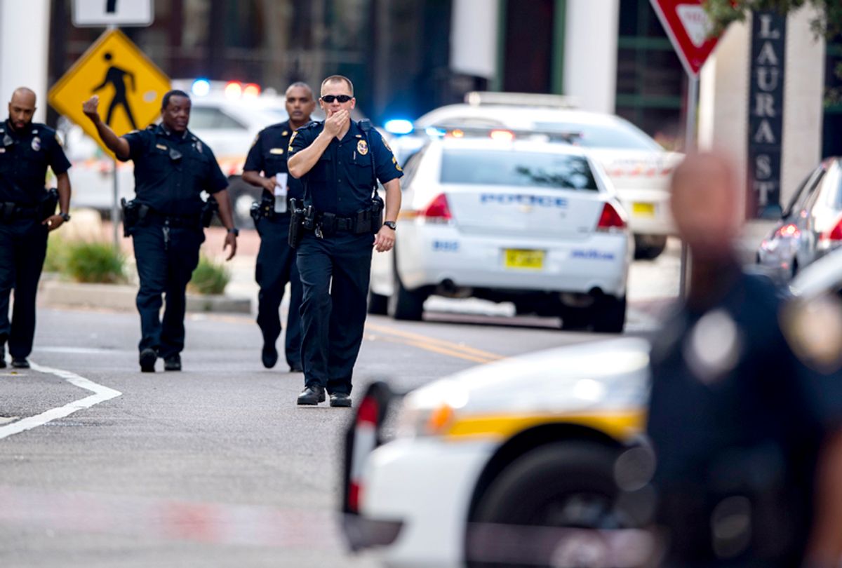 Police gather after a gunman opened fire during an online video game tournament at the Jacksonville Landing in Jacksonville, Fla., Sunday, Aug. 26, 2018.  (AP/Laura Heald)