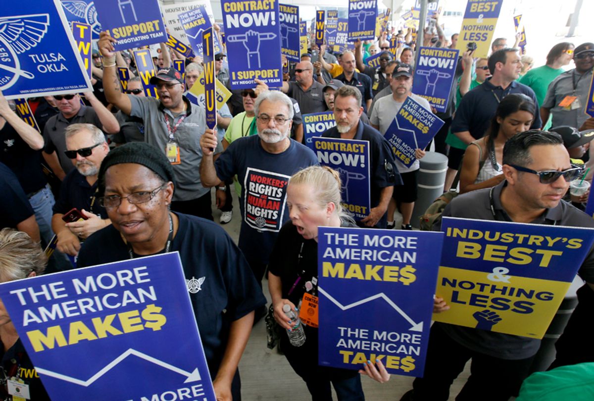 Protesters from a coalition of different unions participated in a picket against American Airlines and its ongoing contract negotiations with ground workers at Dallas/Fort Worth International Airport. (AP/LM Otero)