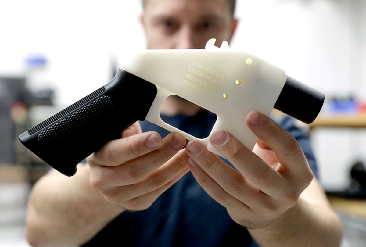 Cody Wilson holds a 3D-printed gun called the Liberator at his shop in Austin, Texas.  (AP/Eric Gay)