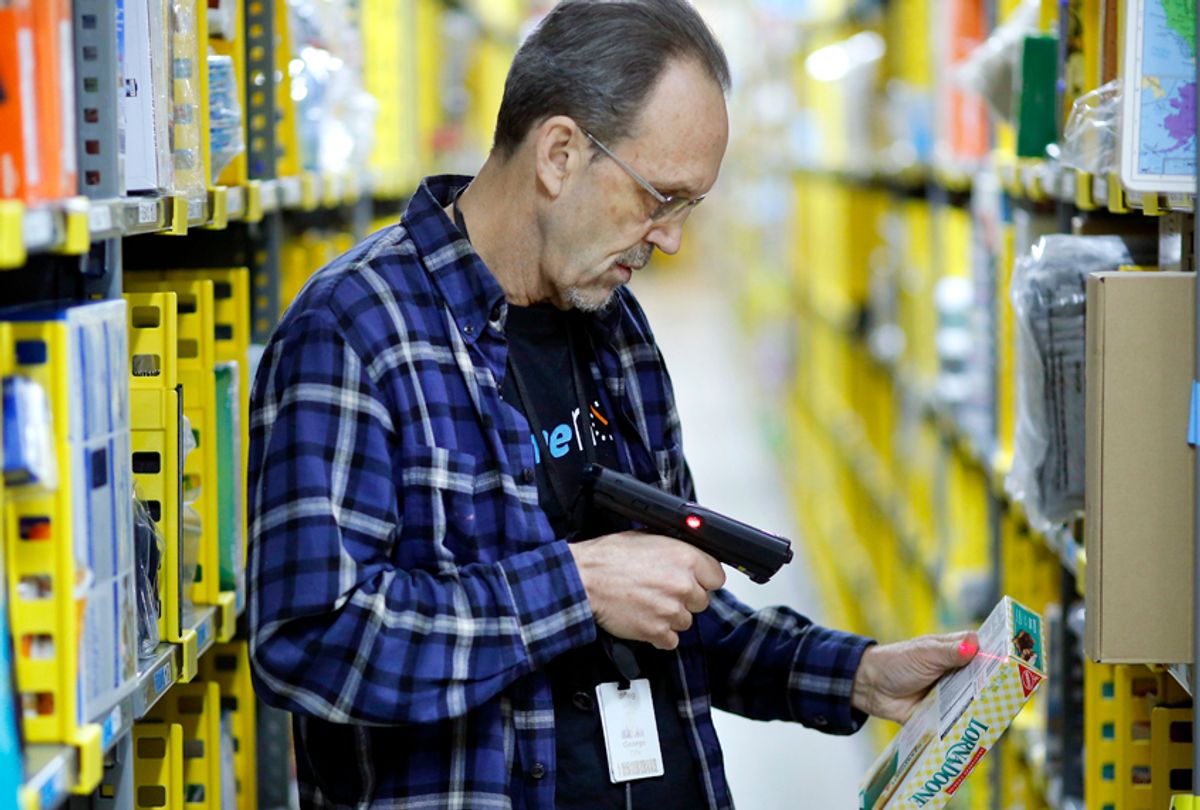 A clerk picks an item from a shelf and scans it to fill a customer order at the Amazon Prime warehouse in New York. (AP/Mark Lennihan)