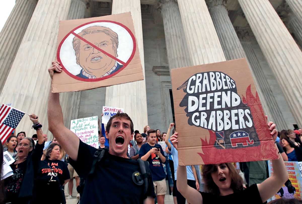 People protest on the steps of the Supreme Court after the confirmation vote of Supreme Court nominee Brett Kavanaugh, on Capitol Hill, Oct. 6, 2018 in Washington. (AP/Alex Brandon)