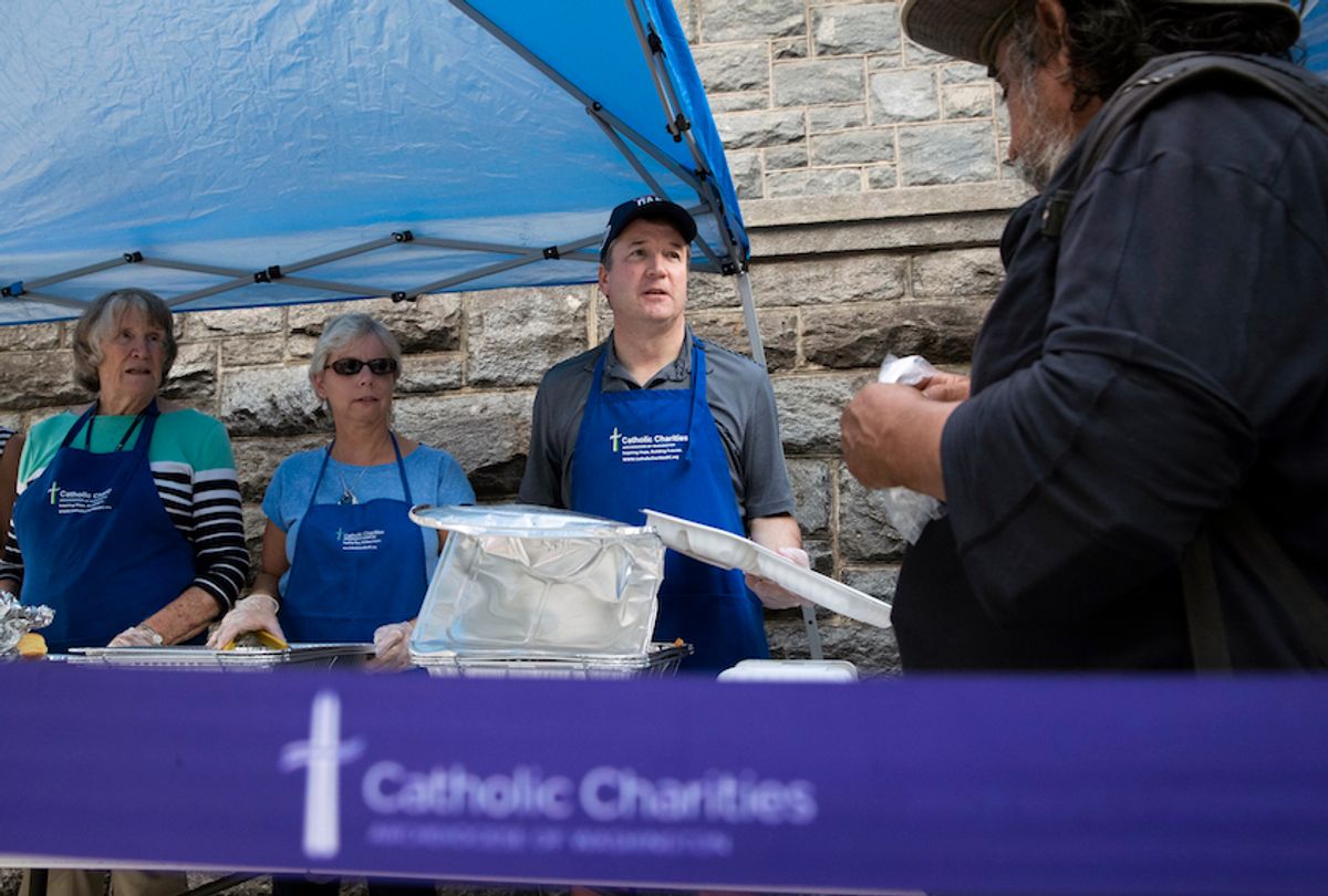 Supreme Court Associate Justice Brett Kavanaugh serves meals to the homeless as he volunteers with Catholic Charities, Oct. 10, 2018, in Washington. (AP/Alex Brandon)