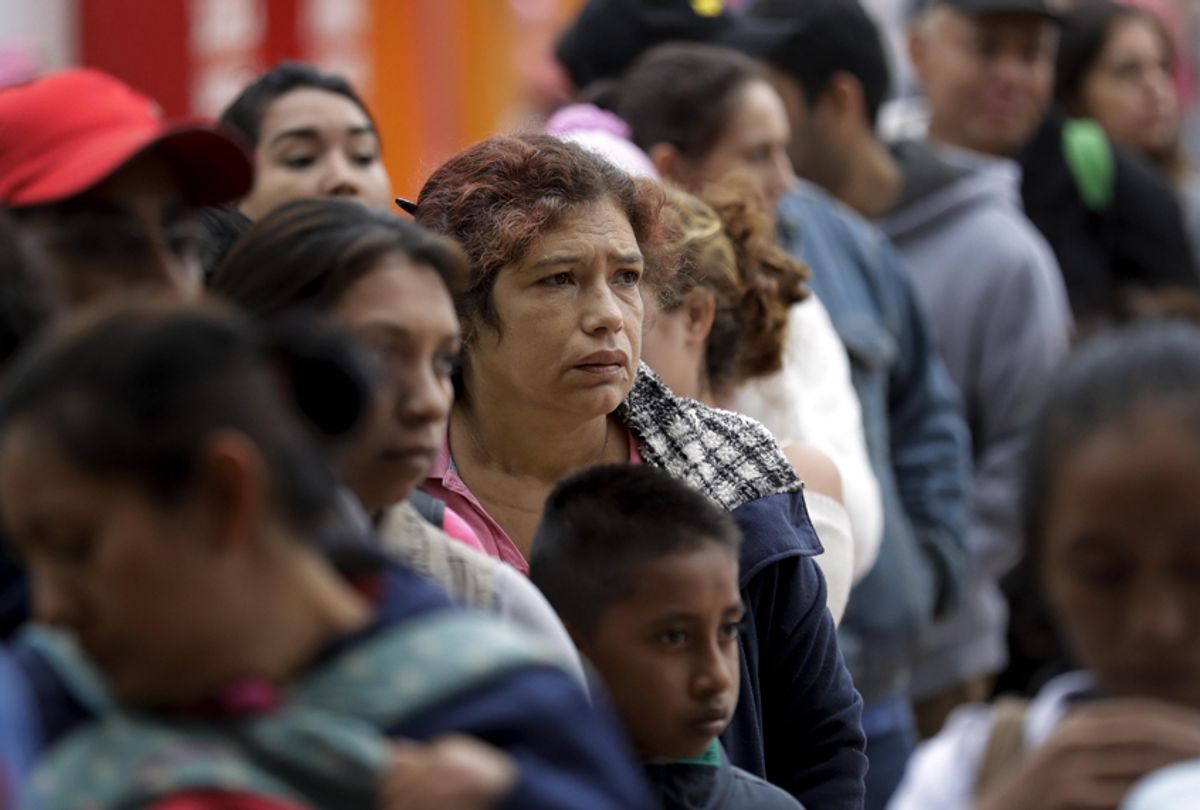 In this Oct. 23, 2018 image, people seeking asylum in the United States line up to receive a number at the border in Tijuana, Mexico. The first obstacle that migrants in a giant caravan may face if they reach the U.S. border is a long wait in Mexico. To enter through San Diego, the wait in Mexico is a month or longer. (AP/Gregory Bull)