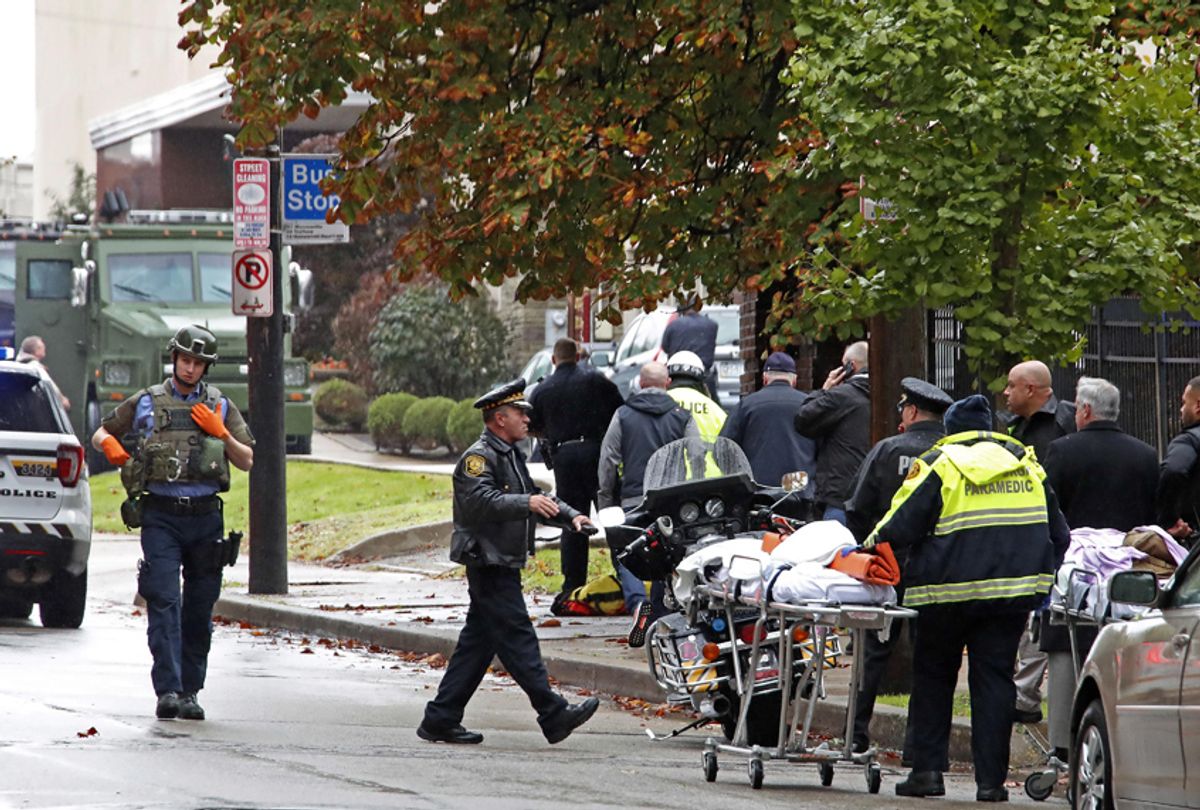 First responders surround the Tree of Life Synagogue, rear center, where a shooter opened fire Saturday, Oct. 27, 2018, wounding three police officers and causing "multiple casualties" according to Police. (AP/Gene J. Puskar)
