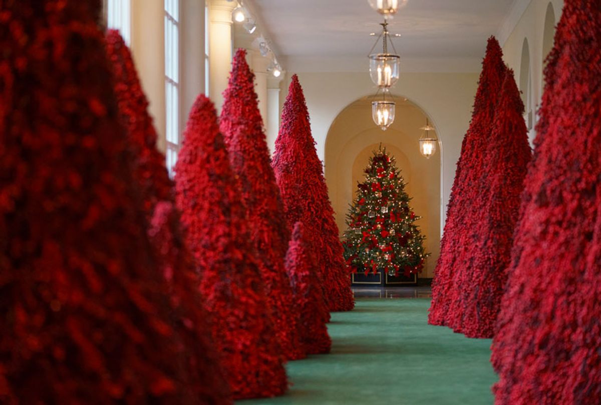 Topiary trees line the East colonnade during the 2018 Christmas Press Preview at the White House in Washington, Monday, Nov. 26, 2018.  (AP/Carolyn Kaster)
