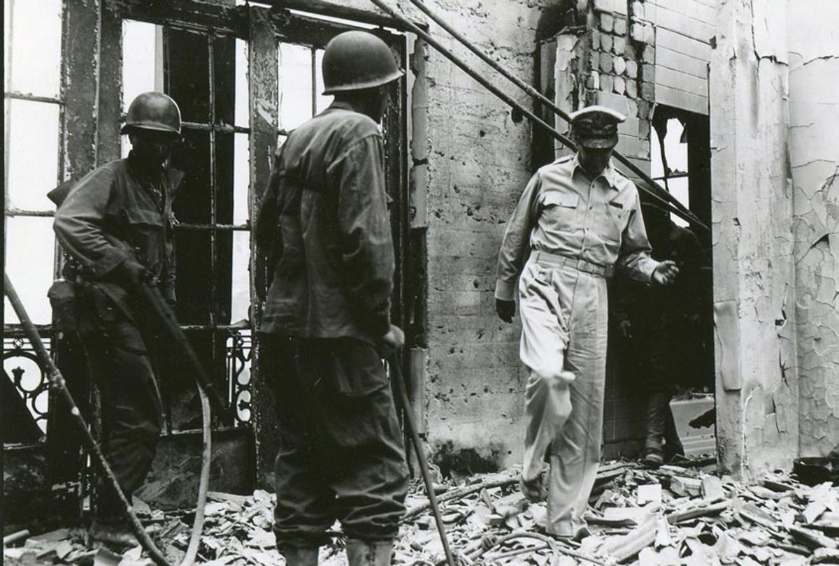 Amid the fighting for the Walled City, MacArthur returns to the ruins of his home atop the once-luxurious Manila Hotel on February 23, 1945. (National Archives)