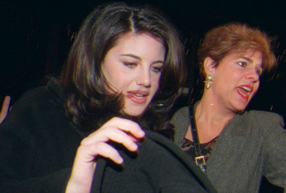 Monica Lewinsky and her stepmother, Barbara Lewinsky push through a large crowd of media as they leave a Santa Monica, Calif., restaurant Thursday Feb. 5, 1998 (AP/Nick Ut)