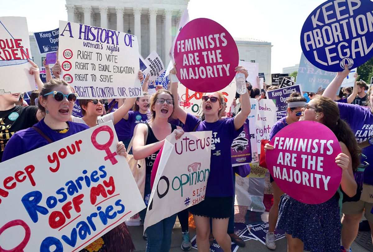 Abortion rights activists cheer after the US Supreme Court struck down a Texas law placing restrictions on abortion clinics, outside of the Supreme Court on June 27, 2016 in Washington, DC. (Getty/Mandel Ngan)