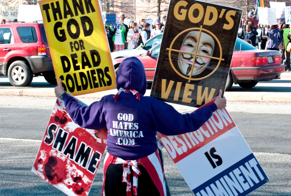 Members of the Westboro Baptist Church stage a protest across the street from Northwestern High School in Hyattsville, Maryland. (Getty/Nicholas Kamm)