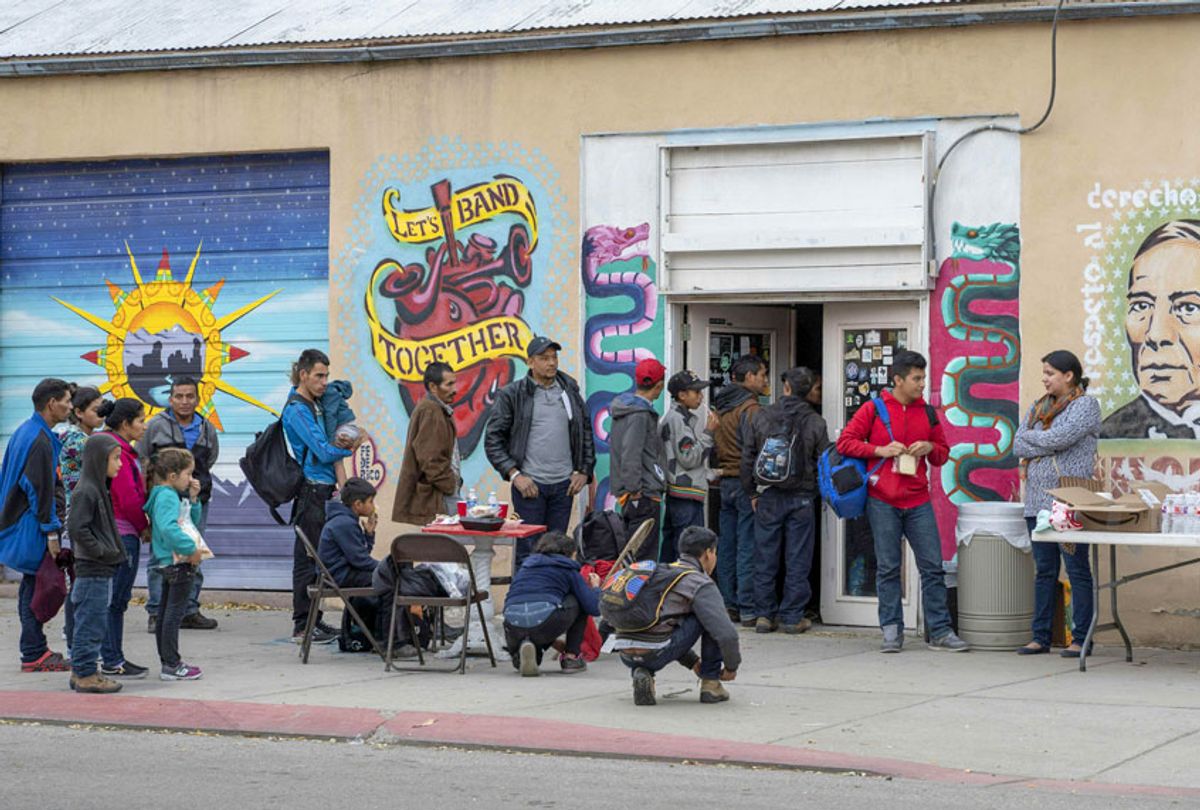 Central American migrants are given food at The Rockhouse Cafe and Gallery after being dropped off in downtown El Paso by Immigration and Customs Enforcement on Christmas day, December 25, 2018.  (Getty/Paul Ratje)