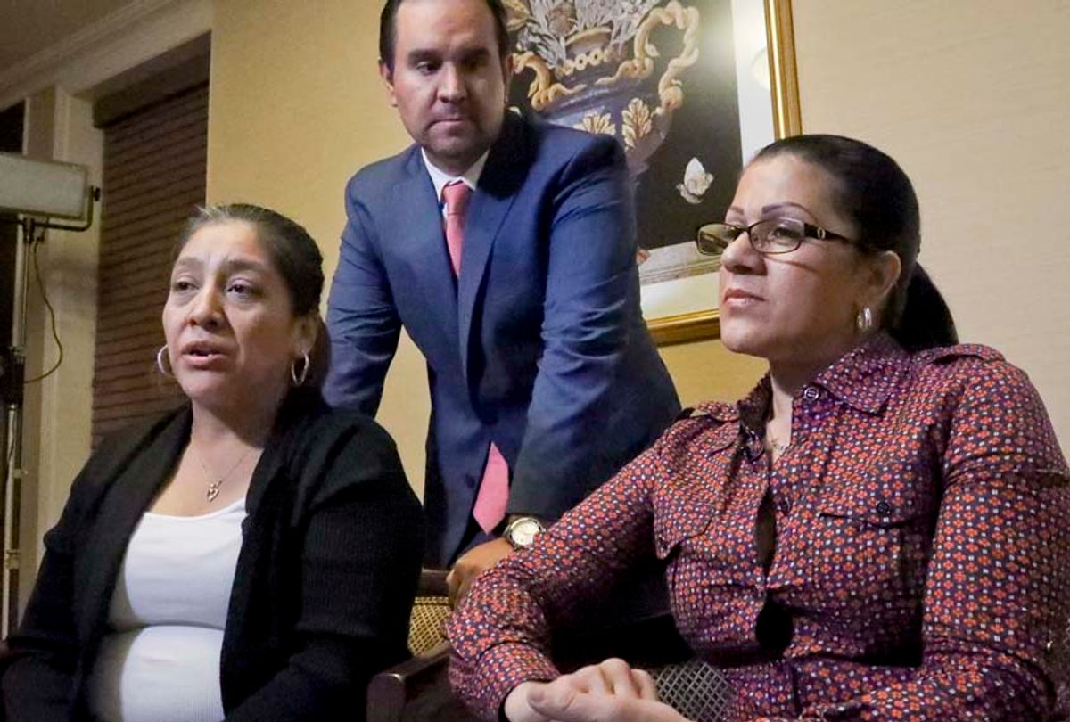 Attorney Anibal Romero, center, joins his clients Victorina Morales, left, and Sandra Diaz, right, during an interview, Friday Dec. 7, 2018, in New York. Morales and Diaz, who recalled their experience working at President Donald Trump's golf resort in Bedminster, N.J., say they used false legal documents to get hired and supervisors knew it. (AP/Bebeto Matthews)