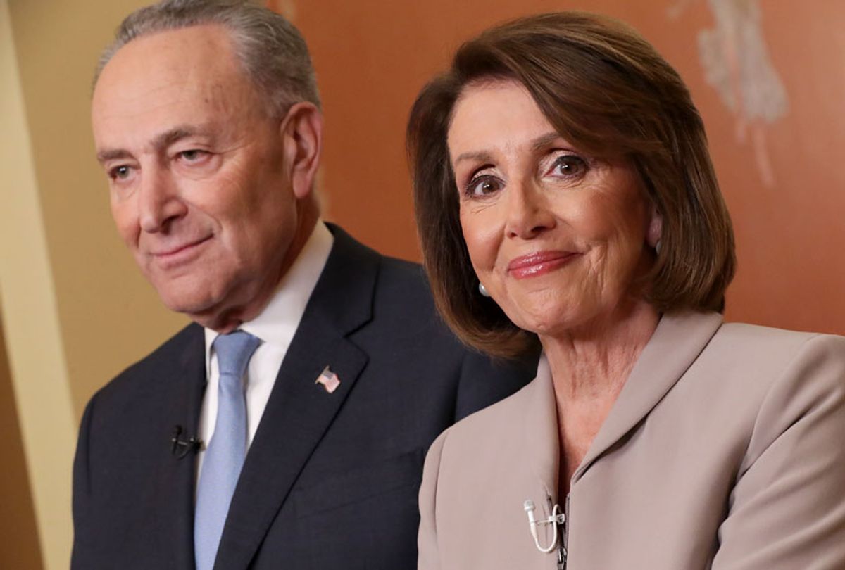 Senate Minority Leader Chuck Schumer of N.Y., and House Speaker Nancy Pelosi of Calif., pose for photographers after speaking on Capitol Hill in response President Donald Trump's address, Tuesday, Jan. 8, 2019, in Washington. (Getty/Chip Somodevilla)
