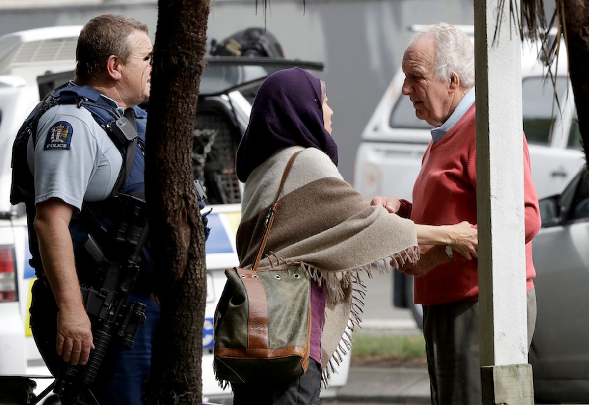 Police escort people away from outside a mosque in central Christchurch, New Zealand, Friday, March 15, 2019.  (AP Photo / Mark Baker)
