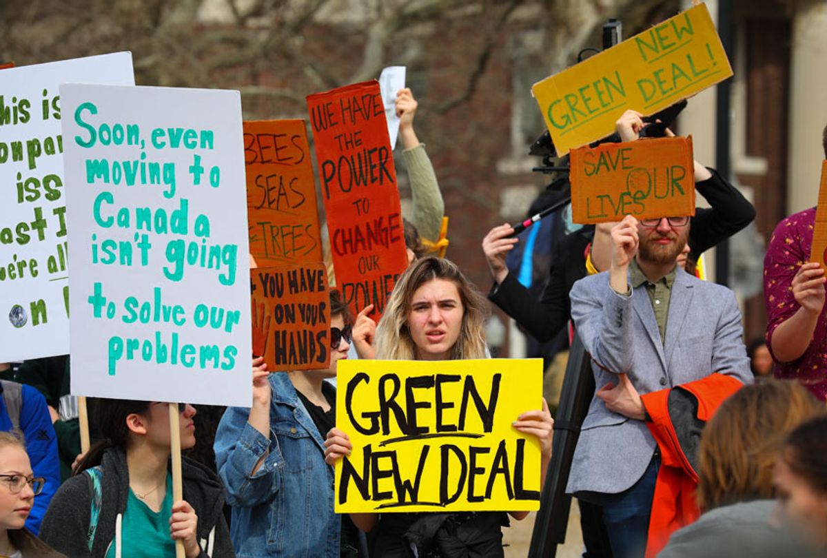 Students gather with signs for a Climate Strike rally on the campus of Columbia University, Friday March 15, 2019, in New York. (AP/Bebeto Matthews)