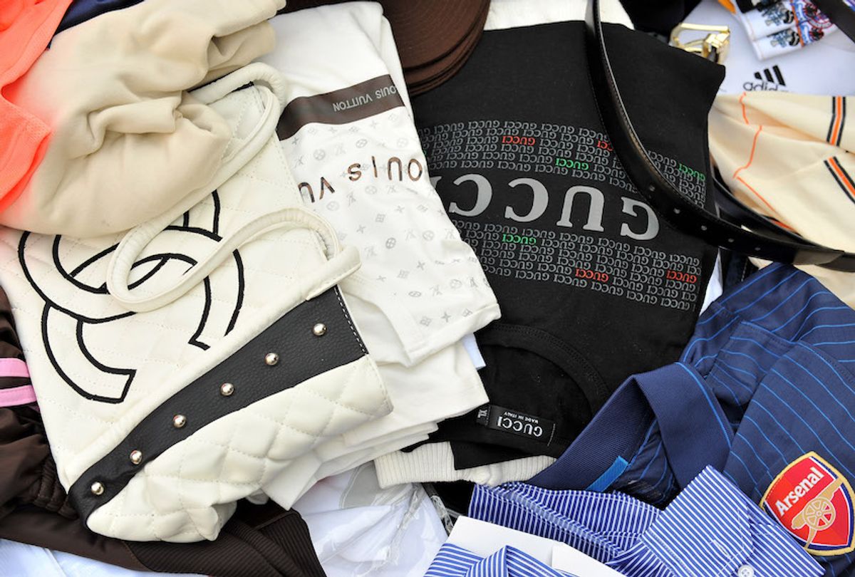 Counterfeit handbags and shirts seized by Customs are displayed at Ministere des Finances on April 22, 2010 in Paris, France.  (Photo by Pascal Le Segretain/Getty Images)