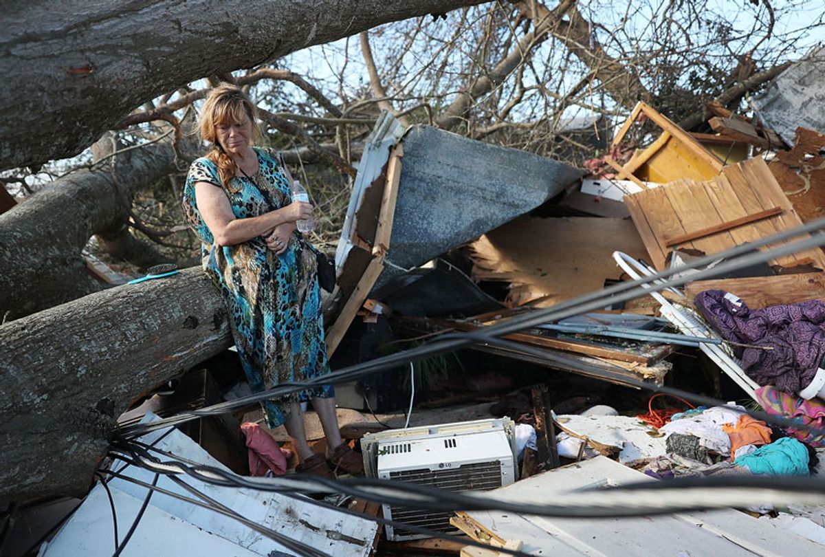 Kathy Coy stands among what is left of her home after Hurricane Michael destroyed it on October 11, 2018 in Panama City, Florida. (Getty/Joe Raedle)