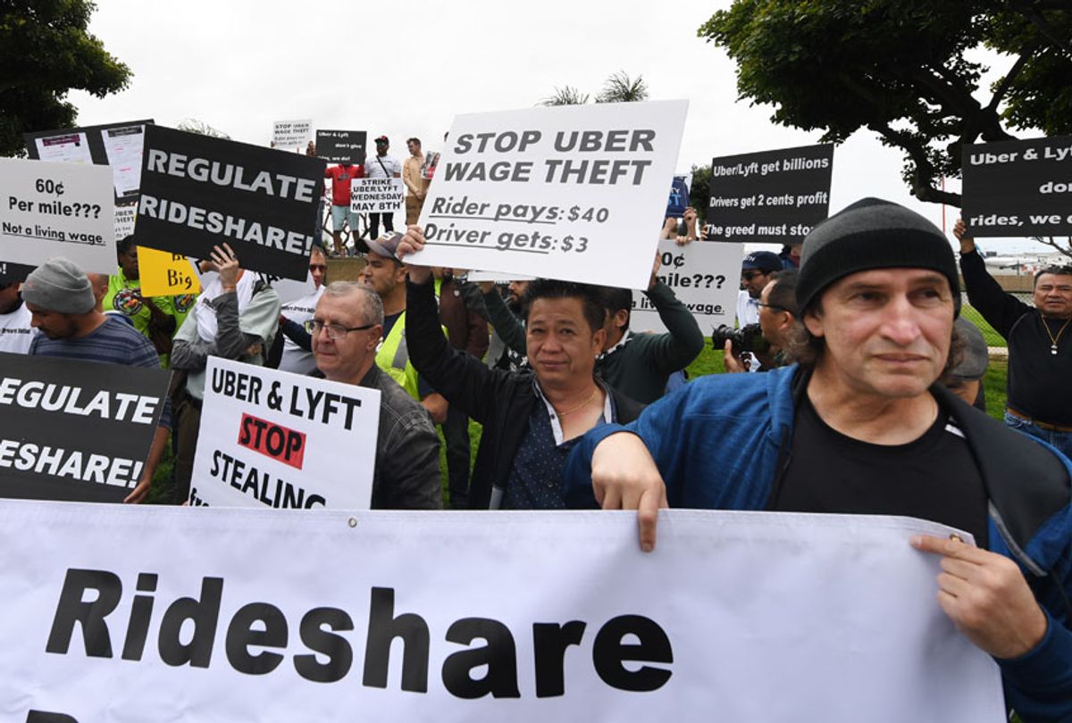 Rideshare drivers for Uber and Lyft stage a strike and protest at the LAX International Airport, over what they say are unfair wages in Los Angeles, California on May 8, 2019. (Getty/Mark Ralston)