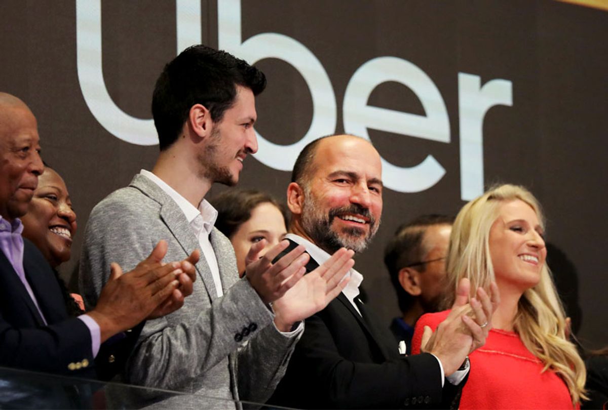 Uber CEO Dara Khosrowshahi (center) joins other employees in ringing the Opening Bell at the New York Stock Exchange (NYSE) as the ride-hailing company Uber makes its highly anticipated initial public offering (IPO) on May 10, 2019 in New York City.  (Getty/Spencer Platt)