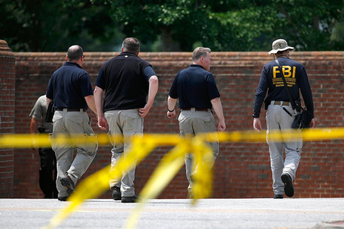 Law enforcement officials walk down a ramp to enter a municipal building that was the scene of a shooting, Sunday, June 2, 2019, in Virginia Beach, Va. DeWayne Craddock, a longtime city employee, opened fire at the building Friday before police shot and killed him, authorities said. (AP Photo/Patrick Semansky) (AP/Patrick Semansky)