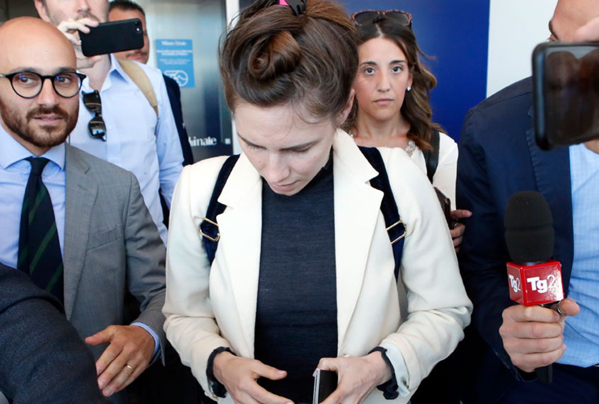 Amanda Knox, center, is approached by journalists upon her arrival in Linate airport, Milan, Italy, Thursday, June 13, 2019. (AP/Antonio Calanni)