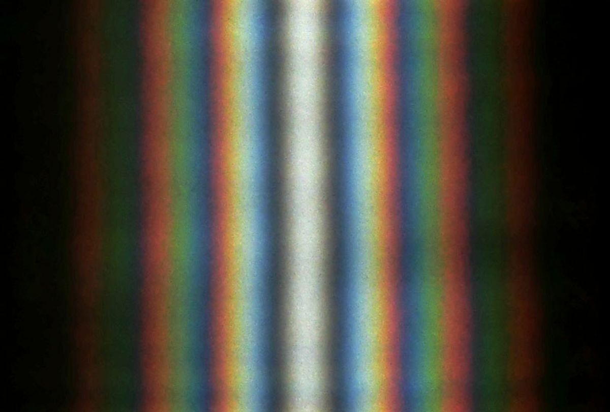 A double-slit interference of the sunlight passing through two slits ~1 cm long and ~0.5 mm apart. (Wikimedia/Aleksandr Berdnikov)