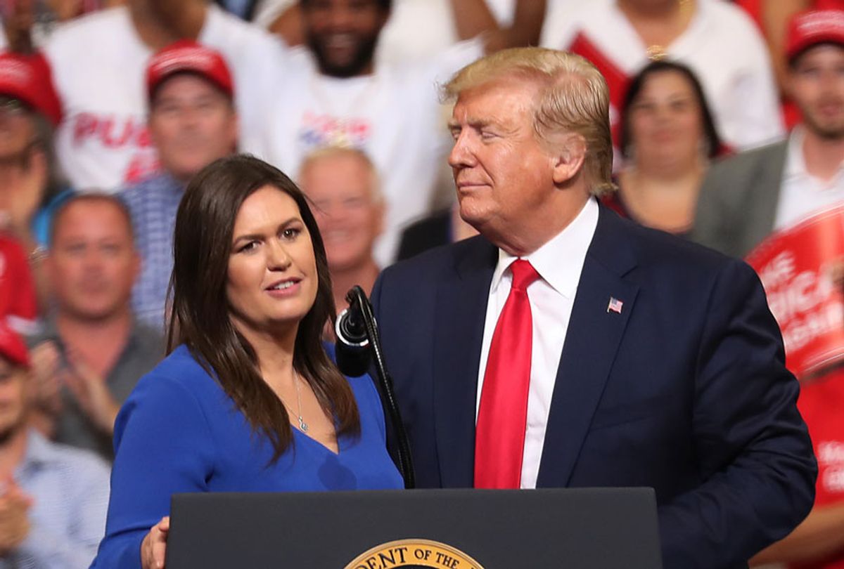 President Donald Trump stands with Sarah Huckabee Sanders, who announced that she is stepping down as the White House press secretary, during his rally where he announced his candidacy for a second presidential term at the Amway Center on June 18, 2019 in Orlando, Florida. (Getty/Joe Raedle)