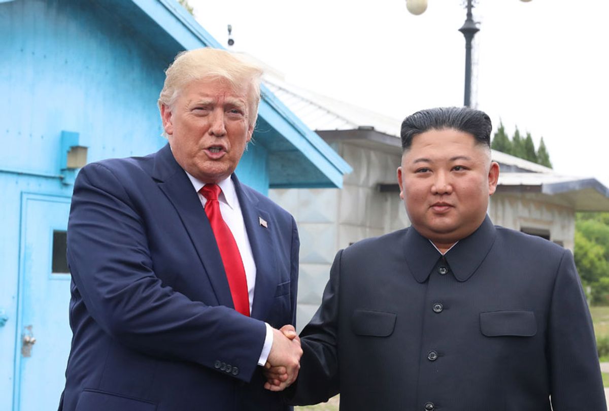 A handout photo provided by Dong-A Ilbo of North Korean leader Kim Jong Un and U.S. President Donald Trump inside the demilitarized zone (DMZ) separating the South and North Korea on June 30, 2019 in Panmunjom, South Korea.  (Handout photo by Dong-A Ilbo via Getty Images)