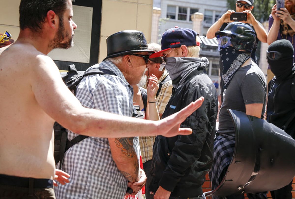 An unidentified right aligning man faces off with Rose City Antifa members at Pioneer Courthouse Square on June 29, 2019 in Portland, Oregon.  (Getty/Moriah Ratner)