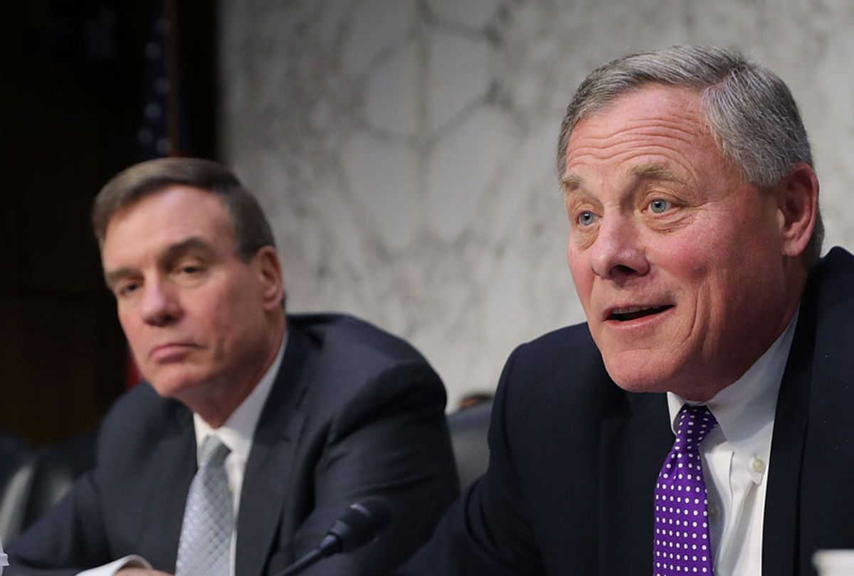 Senate Intelligence Committee ranking member Sen. Mark Warner (D-VA) and Chairman Richard Burr (R-NC) make statements at the close of a hearing with intelligence officials, including the heads of the FBI, CIA and NSA, in the Hart Senate Office Building on Capitol Hill February 13, 2018 in Washington, DC.  (Getty/Chip Somodevilla)